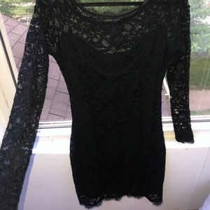 Large black lace dress.